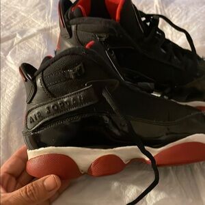 Black  Air Jordan Sneakers 5.5 Y one of the sneakers doesn't have the insole